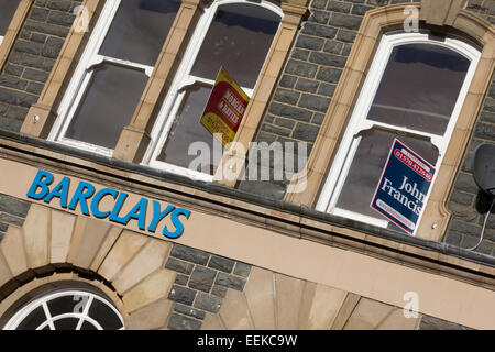 Barclays bank closure at Tregaron in mid Wales. Estate agents' for sale signs outside. Stock Photo