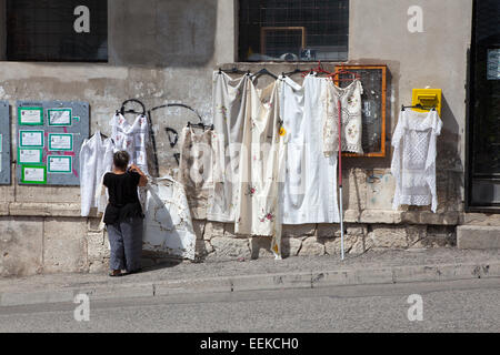 A woman selling dresses in old town. Mostar, Bosnia-Herzegovina Stock Photo