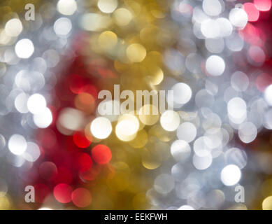 Shiny gold, silver and red bokeh background Stock Photo