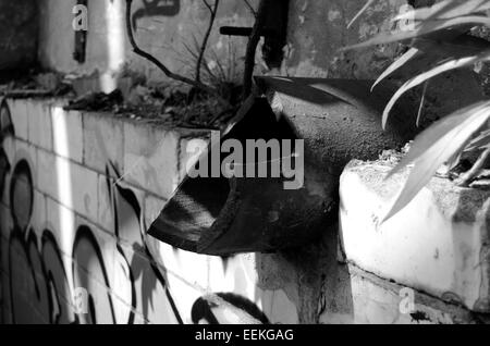 Broken water pipe on the wall inside the derelict pump house building at Govan Graving Docks in Glasgow, Scotland Stock Photo