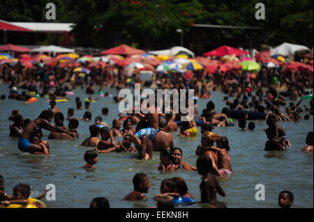 Beach goers enjoy the waters of Palm Piscinão, north of the city of Rio