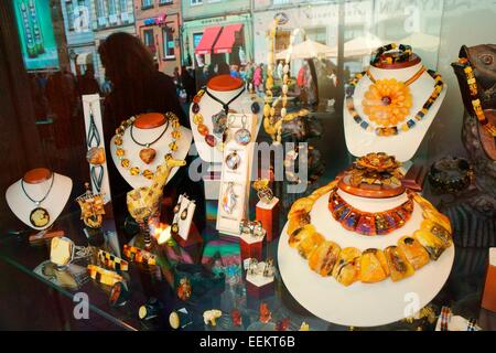 Gdansk Poland. Traditional Baltic coast amber jewellery on sale in the Old Town main street of Dlugi Targ. Shop window display Stock Photo