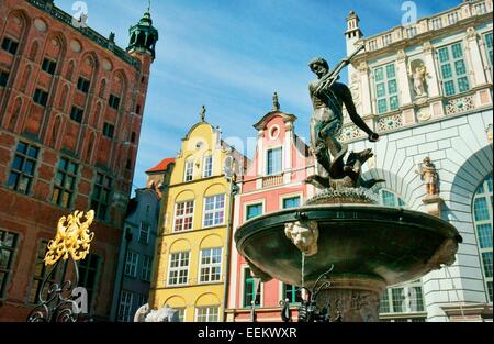 Gdansk Poland. The Neptune Fountain, erected 1633, in front of the ornate façades of the Main Town Hall and the Court of Artus Stock Photo
