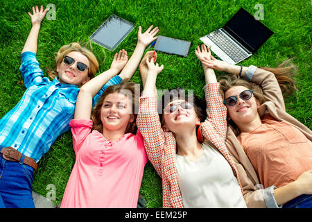 Young and happy girlfriends or classmates having fun at the School or University break. Stock Photo