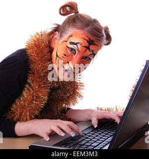 Girl in appearance a tiger with a notebook. Stock Photo