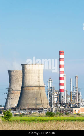 Oil processing installations with adjoining cooling chimneys of a refinery, in landscape view Stock Photo