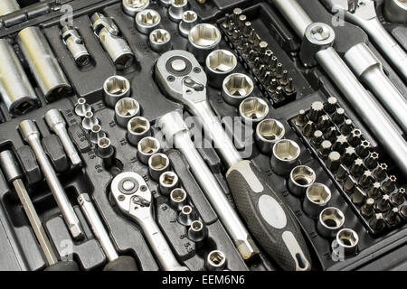 Set of tools made of chrome vanadium alloy containing wrenches and different size bits and tubular extensions in a multipurpose Stock Photo