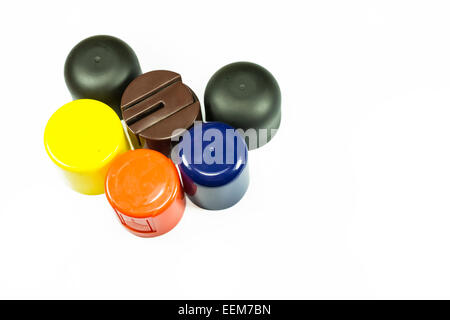 Colored plastic caps from various cosmetic products,isolated on white Stock Photo