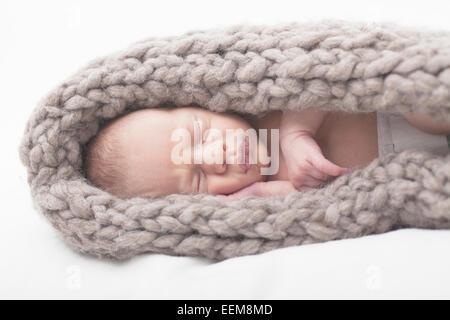 Close-up of a newborn baby boy in a blanket Stock Photo