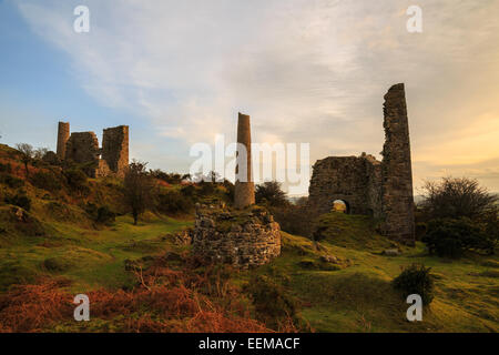 Warm evening light being cast over the long redundant caradon copper mines in east cornwall Stock Photo