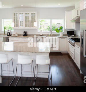 Stools, breakfast bar and counters in modern kitchen Stock Photo