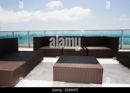 Sofas and coffee table on modern patio Stock Photo
