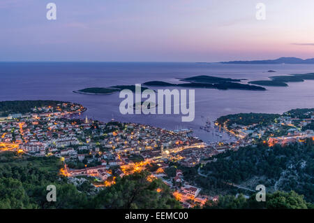 Aerial view of coastal town illuminated at night Stock Photo