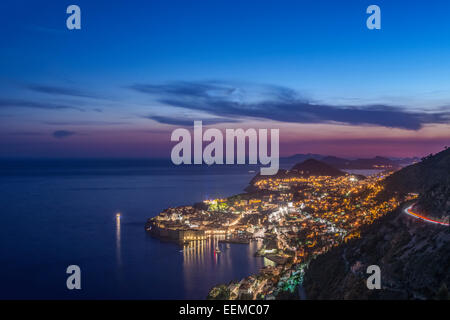 Aerial view of coastal city illuminated at night, Dubrovnik, Dubrovnik-Neretva, Croatia Stock Photo