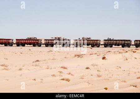 The Iron Ore Express is longest train in the world and shuttles people animals and ore from the desert to the coast, Mauritania. Stock Photo