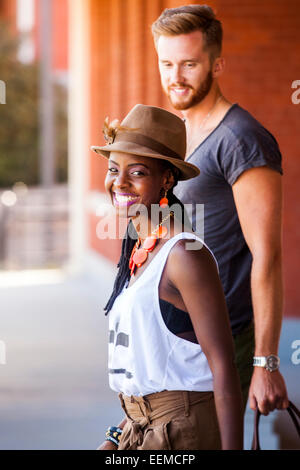 Couple walking together outdoors Stock Photo