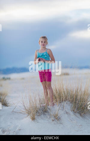 Girl posing on sand dune at the beach Stock Photo - Alamy