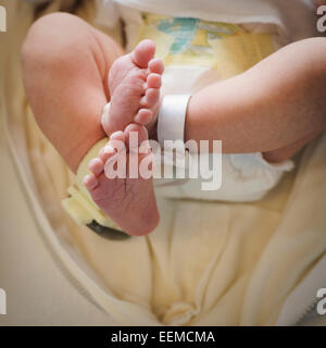 Close up of feet of mixed race newborn baby Stock Photo