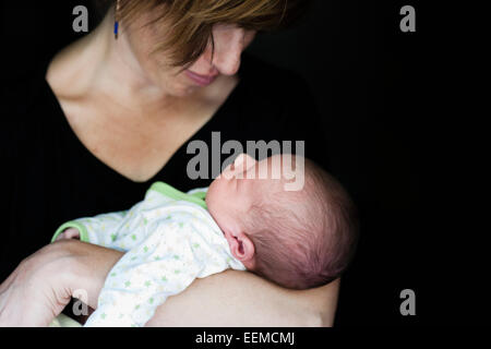 Close up of mother holding newborn baby Stock Photo