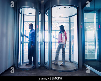 Business people using fingerprint lock system in office Stock Photo