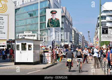 Germany, Berlin: Tourists walking and biking at former US Checkpoint Charlie Stock Photo