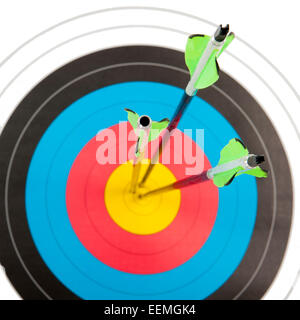 The bull's eye of an archery target with three arrows in short depth of ...