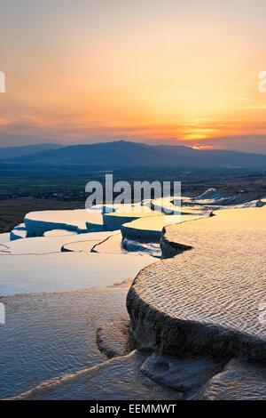 View from travertine terraces of Pamukkale at sunset. Pamukkale, Denizli Province, Turkey. Stock Photo