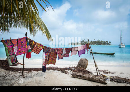 Cloths for sale hang on a line on Tiadup Island in the Coco Bandero Cays, San Blas Islands, Panama Stock Photo
