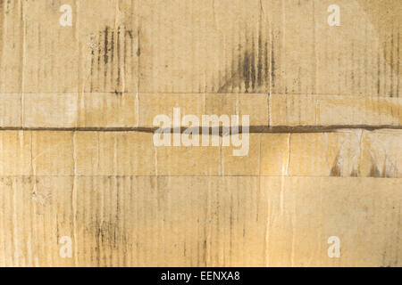 dirty cardboard box with clear adhesive tape Stock Photo