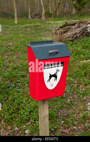 Dog waste bin in woodland Stock Photo