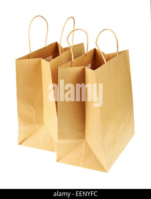 Empty brown recycled paper shopping bags isolated on white background. Side view from top. Stock Photo
