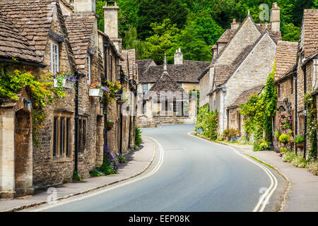 The picturesque Cotswold village of Castle Combe  in Wiltshire with its market cross. Stock Photo