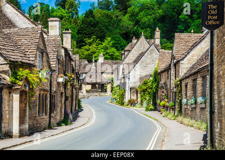 The picturesque Cotswold village of Castle Combe in Wiltshire with its market cross. Stock Photo