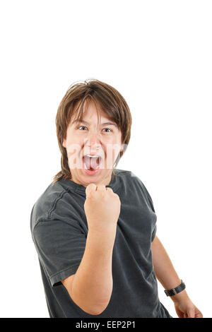 cute young male chubby kid or boy smiling and confidently posing with fist up like success in black dark t-shirt on white backgr Stock Photo