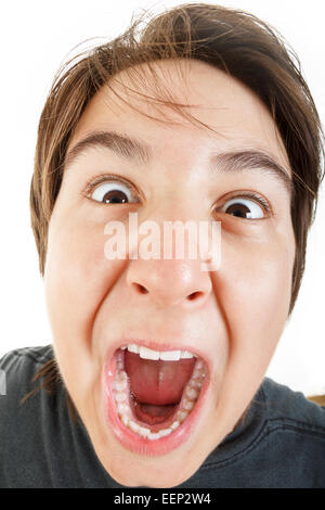 Close up of a young scared and frightened woman, covering herself