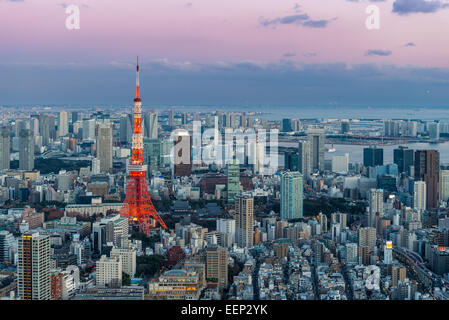 Tokyo Tower stands out among the Tokyo cityscape as evening approaches. Stock Photo