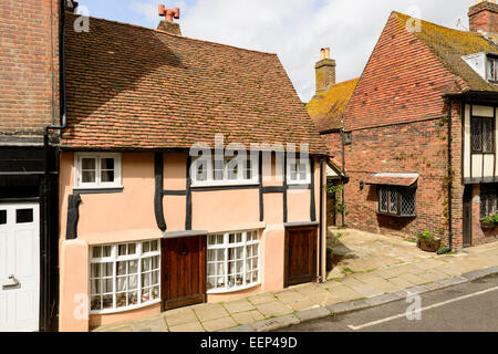 view of old wattle house and a brick one nearby on a street in the historic village of Hastings, East Sussex Stock Photo