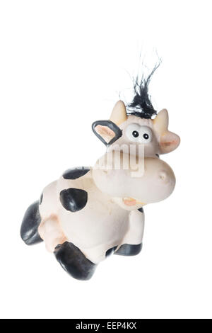 Fanny photo of black and white cow toy. Object isolated on white background without shadows Stock Photo