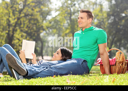 Couple having a picnic on nice sunny day in park Stock Photo