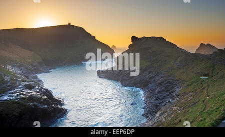 Sunset over the harbour entrance at Boscastle on the North Cornwall Coast England UK Europe Stock Photo