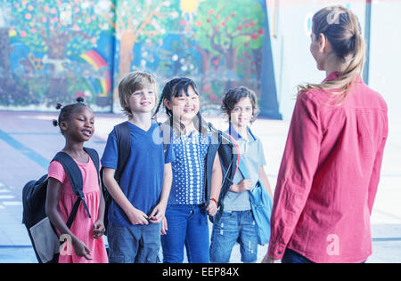 Elementary students in uniforms play in a school yard next to a cherry  blossom tree in middle of yard in spring morning on outskirts of Da Lat  Stock Photo - Alamy