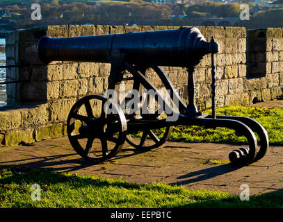 Old defensive cannon pointing out to sea mounted on the Town Walls at Berwick upon Tweed in Northumberland England UK Stock Photo