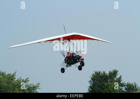 Accuracy contest of dropping a beanbag on a target. Adult man flying and adult woman with the beanbag.AIRBORNE WINDSPORTS model Stock Photo