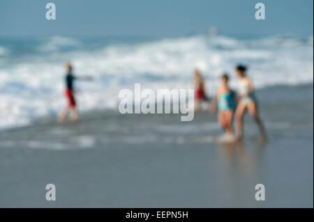 Abstract beach vacation, Umhlanga Rocks waterfront, Durban, South Africa, focus blur, people playing in surf, seaside holiday, leisure graphic, sea Stock Photo