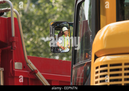 Heavy construction equipment operator in excavator Stock Photo