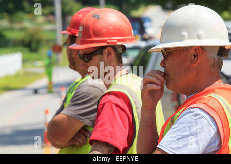 Construction workers viewing project Stock Photo