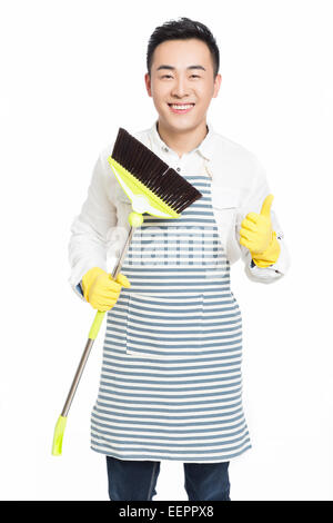 chinese male with cleaning sweep, white background Stock Photo