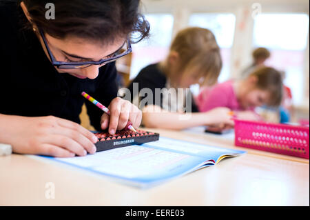 children in school working with mathematics Stock Photo