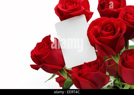 Bouquet of roses with blank gift card on white background Stock Photo