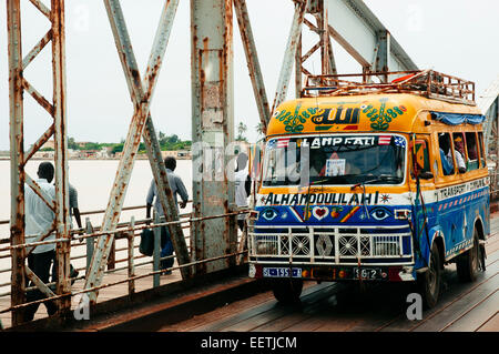 Share taxi crossing Faidherbe bridge, Saint Louis, Senegal. Stock Photo